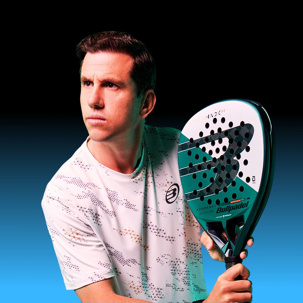 Top Game padel player holding Bullpadel Hack racket in ready stance